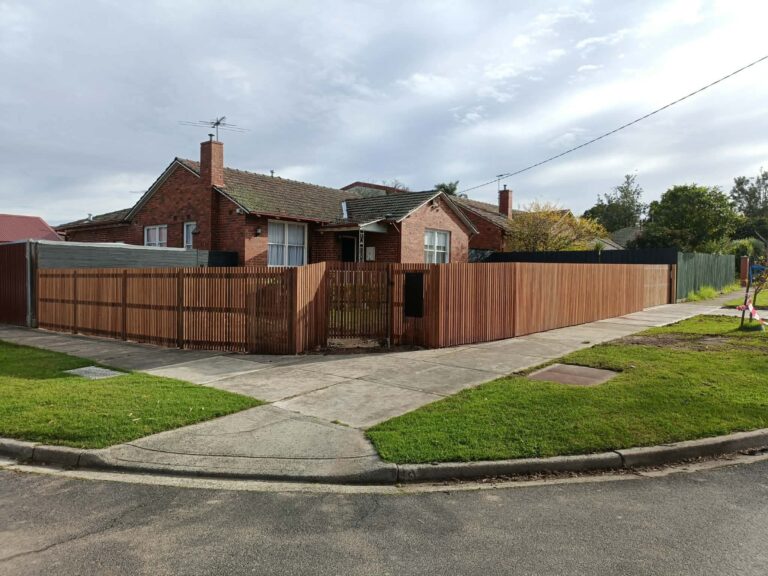 Modern fencing solutions featuring secure boundary design and timber panels for an Australian home