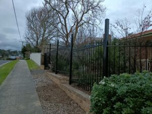 Modern aluminium slat security barrier setup by experienced fencing contractors in Melbourne