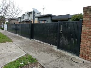 Custom front feature structure with automated sliding gate by fencing contractors in Melbourne