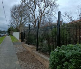 Modern aluminium slat security barrier setup by experienced fencing contractors in Melbourne
