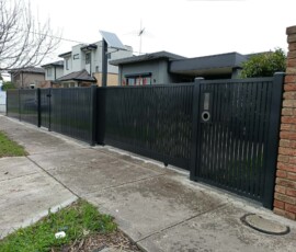 Custom front feature structure with automated sliding gate by fencing contractors in Melbourne